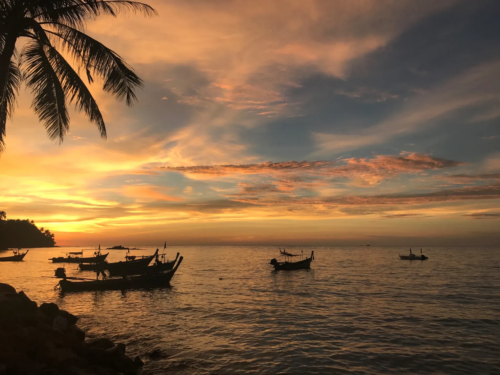 Sunset over Bang Tao beach, minutes from Live More Clinic